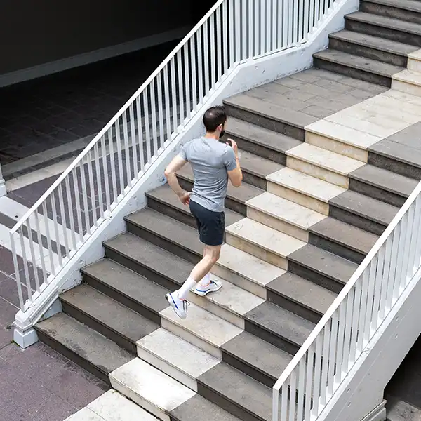 Man jogging up stairs