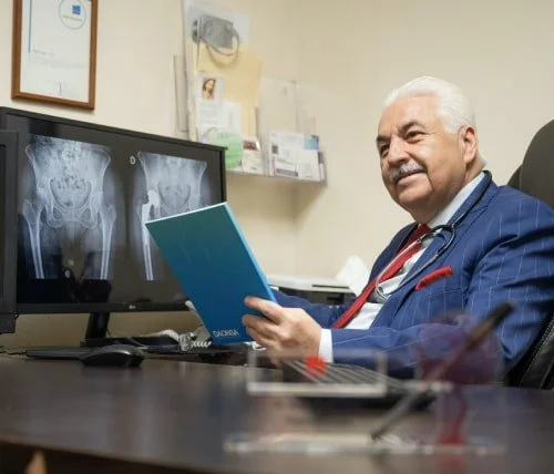 Orthopedic surgeon in Mexico talking with his patient